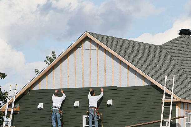Professional Storm Damage Siding Repair technician working in Mims, FL